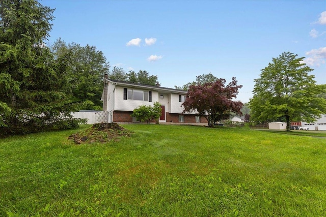 76 Maureen Dr, Middletown, NY 10940 - rear view of house with brick siding and a chimney