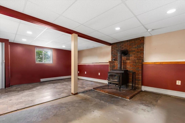 76 Maureen Dr, Middletown, NY 10940 - below grade area featuring a wood stove, a baseboard radiator, a drop ceiling, and recessed lighting