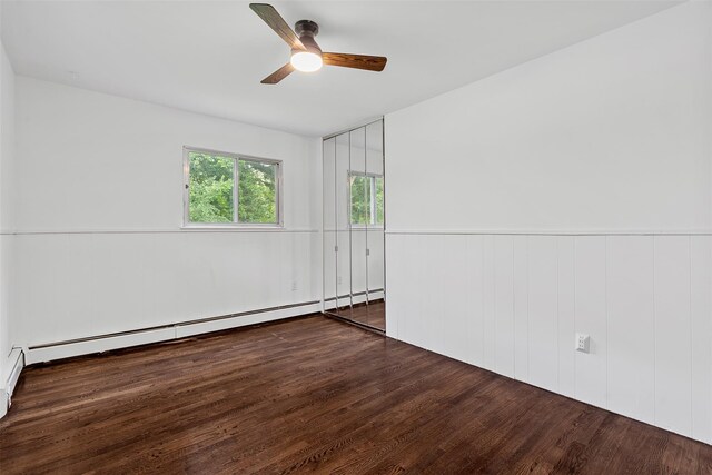 4 Westbrook Dr, Cortlandt Manor, NY 10567 - unfurnished room with wood finished floors, ceiling fan, a baseboard heating unit, and wainscoting