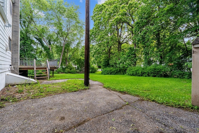 4 Westbrook Dr, Cortlandt Manor, NY 10567 - view of green lawn with a wooden deck and view of scattered trees