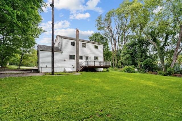 4 Westbrook Dr, Cortlandt Manor, NY 10567 - rear view of property featuring a lawn, a chimney, and a wooden deck