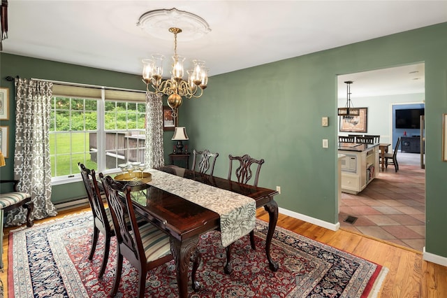 4 Scenic Dr, South Salem, NY 10590 - dining area with a chandelier and light wood-style floors