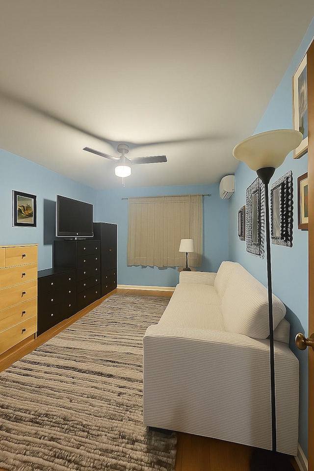 22-39 74th St, East Elmhurst, NY 11370 - living area with an AC wall unit and a ceiling fan