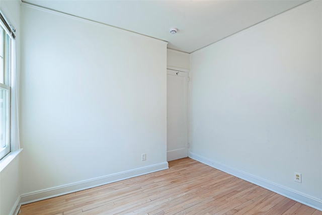147 Nugent St, New Hyde Park, NY 11040 - unfurnished bedroom with light wood-type flooring and baseboards