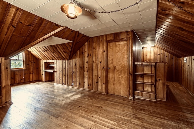 147 Nugent St, New Hyde Park, NY 11040 - bonus room with wood walls, lofted ceiling, and hardwood / wood-style floors