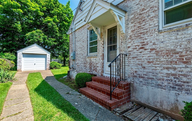 147 Nugent St, New Hyde Park, NY 11040 - view of exterior entry with brick siding and a garage