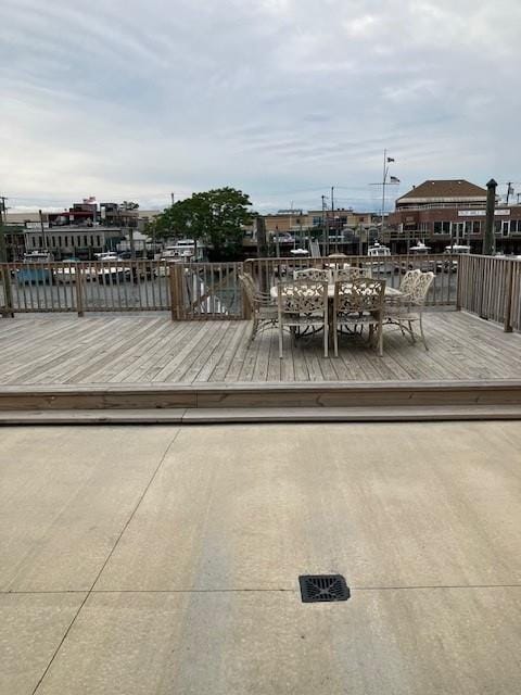 16330 95th St, Howard Beach, NY 11414 - wooden deck with outdoor dining area