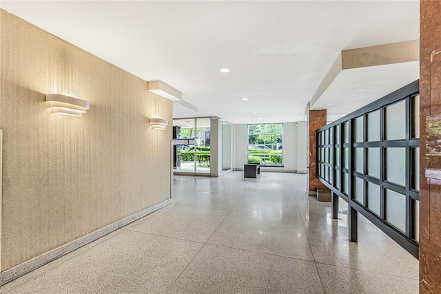 5550 Fieldstone Rd Unit 1C, Bronx, NY 10471 - hallway featuring a wall of windows and recessed lighting