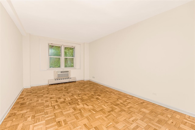 5550 Fieldstone Rd Unit 1C, Bronx, NY 10471 - unfurnished room featuring a baseboard radiator and a wall mounted air conditioner