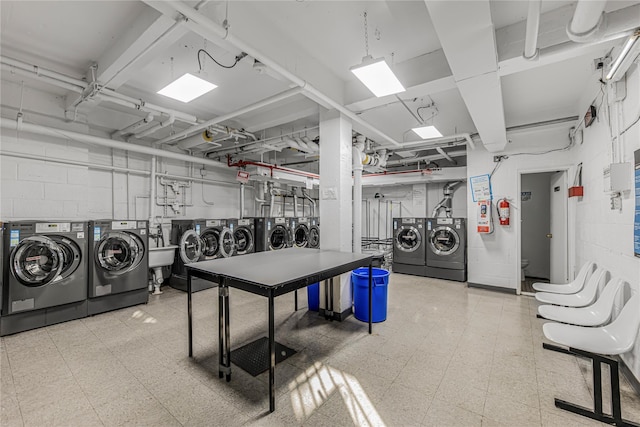 5550 Fieldstone Rd Unit 1C, Bronx, NY 10471 - interior space with independent washer and dryer, tile patterned floors, and concrete block wall