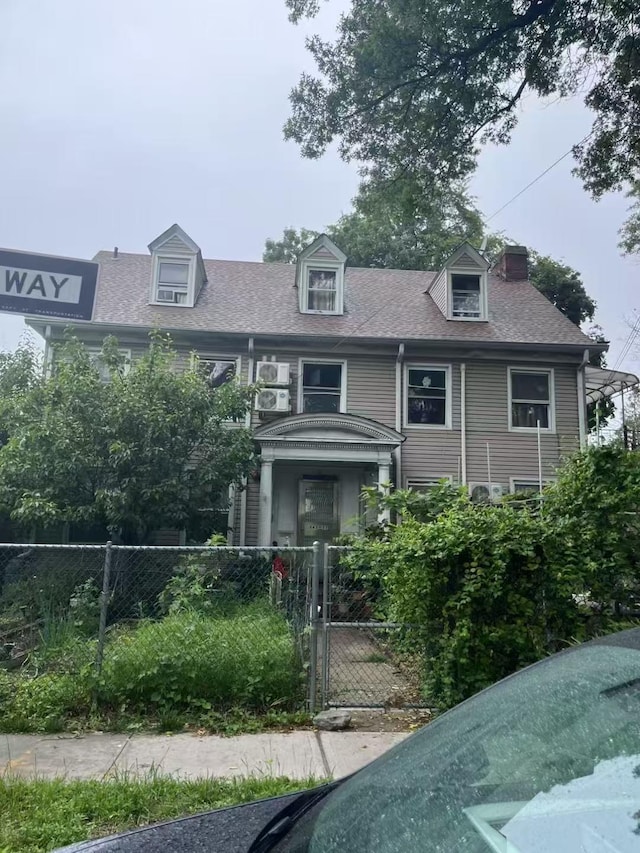 143-37 Beech Ave, Flushing, NY 11355 - view of front of property featuring a fenced front yard, a gate, and a shingled roof