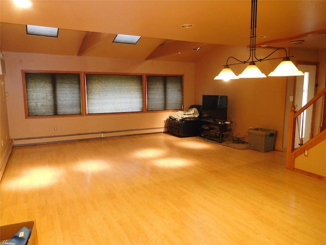 231 Willowood Dr, Wantagh, NY 11793 - living room with wood finished floors, vaulted ceiling, baseboard heating, stairs, and recessed lighting
