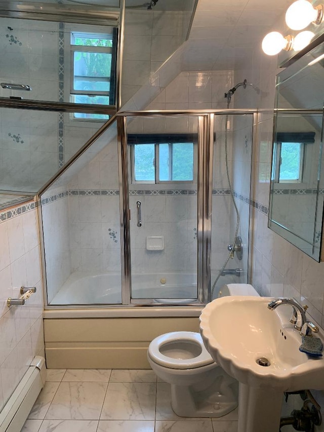231 Willowood Dr, Wantagh, NY 11793 - bathroom with a baseboard heating unit, tile walls, combined bath / shower with glass door, and marble look tile flooring