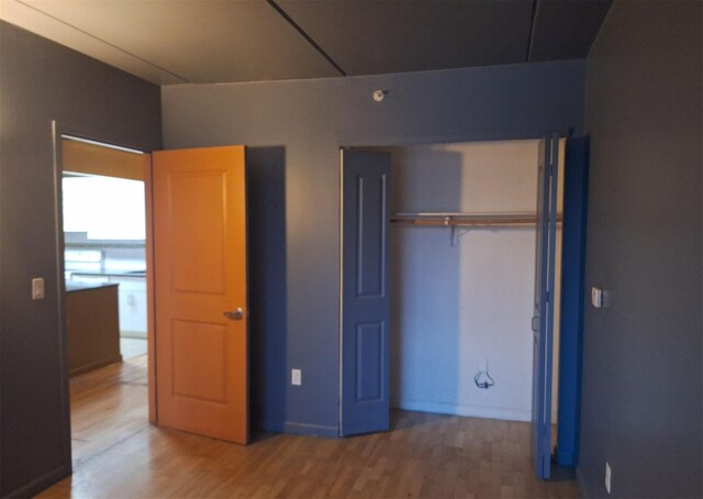 715 Fox St Unit 5J, Bronx, NY 10455 - unfurnished bedroom with wood finished floors and a closet
