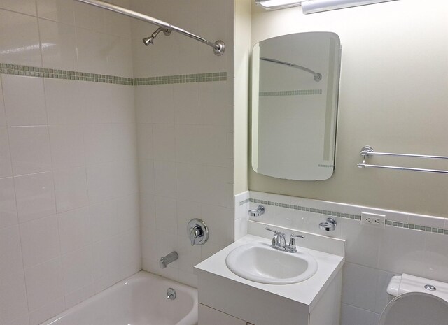 715 Fox St Unit 5J, Bronx, NY 10455 - full bath featuring  shower combination, vanity, and tile walls