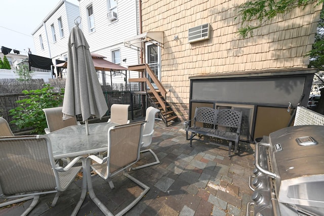 5920 69th Pl, Maspeth, NY 11378 - view of patio with cooling unit, outdoor dining space, stairway, grilling area, and a wall unit AC