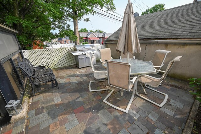 5920 69th Pl, Maspeth, NY 11378 - view of patio featuring outdoor dining area and a grill