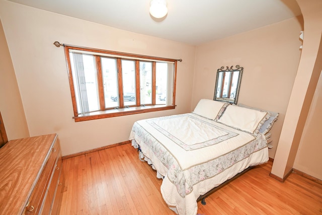 5920 69th Pl, Maspeth, NY 11378 - bedroom featuring baseboards and light wood-style flooring