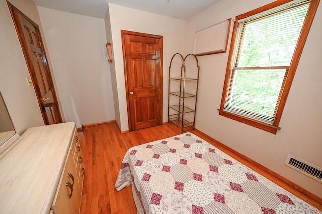 5920 69th Pl, Maspeth, NY 11378 - bedroom with light wood-style floors and baseboards