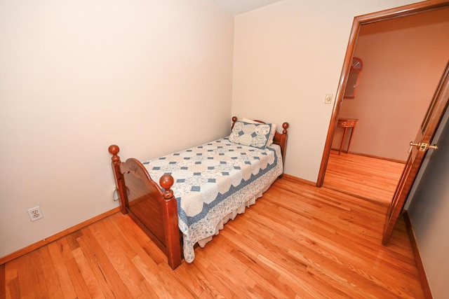 5920 69th Pl, Maspeth, NY 11378 - bedroom with light wood-style floors and baseboards