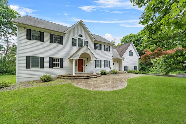 16 Apple Summit Ln, Lagrangeville, NY 12540 - colonial-style house with a front lawn and a shingled roof