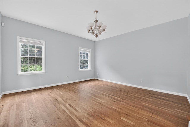16 Apple Summit Ln, Lagrangeville, NY 12540 - unfurnished room featuring a chandelier and light wood-style floors