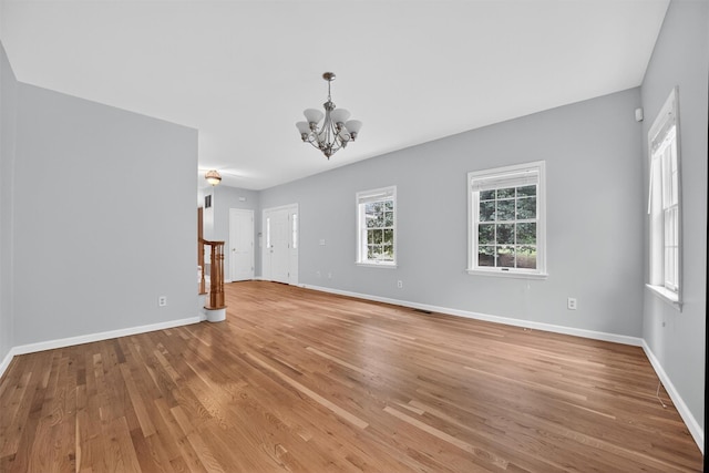 16 Apple Summit Ln, Lagrangeville, NY 12540 - empty room with a chandelier, light wood-style floors, and stairs