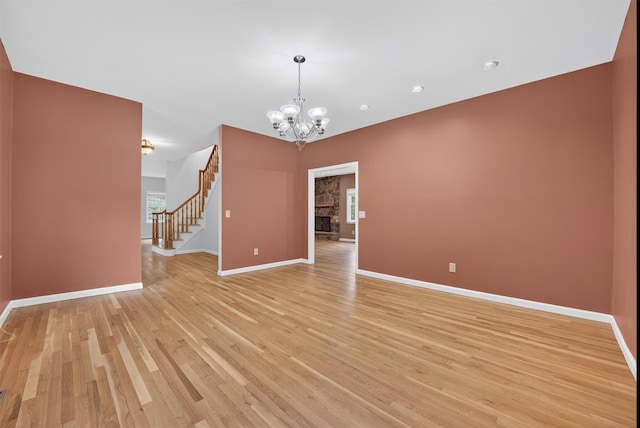 16 Apple Summit Ln, Lagrangeville, NY 12540 - empty room featuring a chandelier, light wood-style flooring, stairs, and recessed lighting