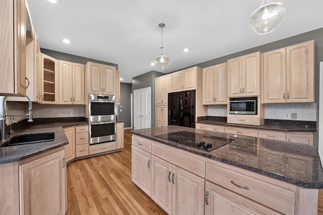 16 Apple Summit Ln, Lagrangeville, NY 12540 - kitchen featuring light brown cabinets, black appliances, light wood-style floors, glass insert cabinets, and backsplash