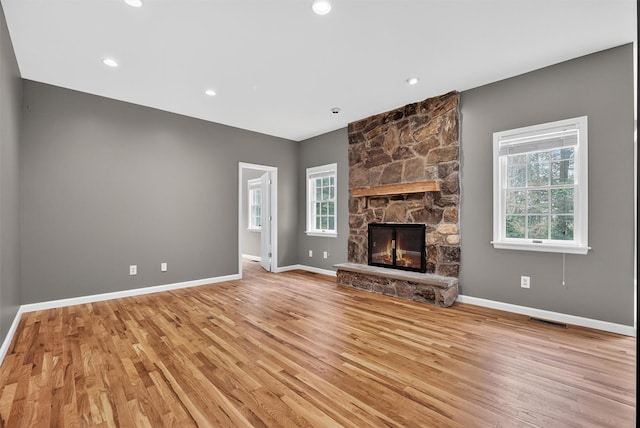 16 Apple Summit Ln, Lagrangeville, NY 12540 - unfurnished living room with plenty of natural light, light wood-style flooring, a fireplace, and recessed lighting