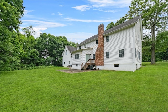 16 Apple Summit Ln, Lagrangeville, NY 12540 - rear view of property with a chimney, a yard, and a shingled roof