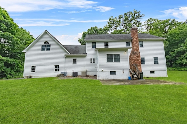16 Apple Summit Ln, Lagrangeville, NY 12540 - rear view of property with a lawn, a chimney, roof with shingles, and a patio area