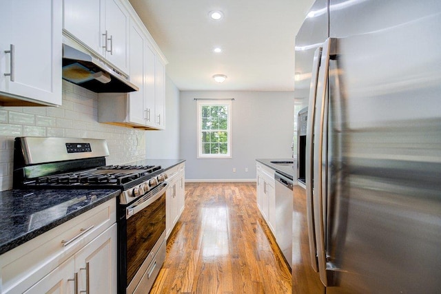 31 Pinto Rd W, Middletown, NY 10941 - kitchen featuring stainless steel appliances, under cabinet range hood, light wood-style floors, tasteful backsplash, and white cabinets