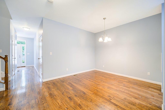 31 Pinto Rd W, Middletown, NY 10941 - spare room with wood finished floors and a chandelier
