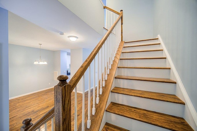 31 Pinto Rd W, Middletown, NY 10941 - stairway featuring a chandelier and wood finished floors