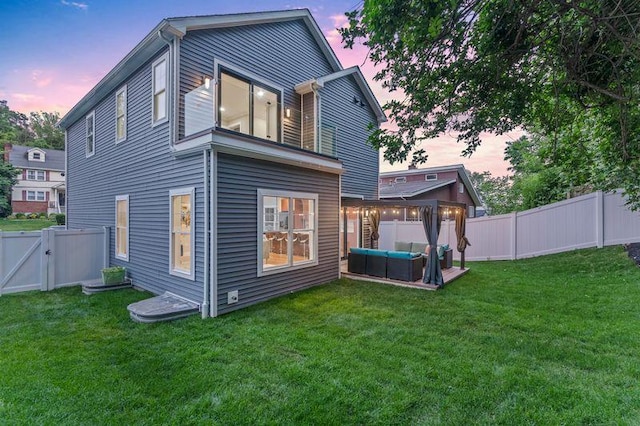 105 Valley Rd, White Plains, NY 10604 - back of house with a fenced backyard, a gate, and an outdoor living space