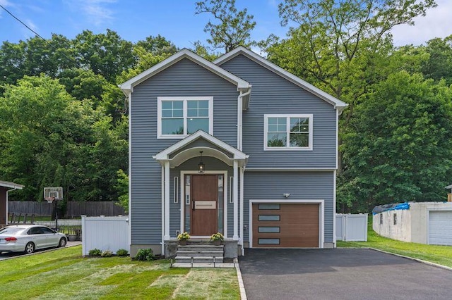 105 Valley Rd, White Plains, NY 10604 - traditional home featuring asphalt driveway and a garage