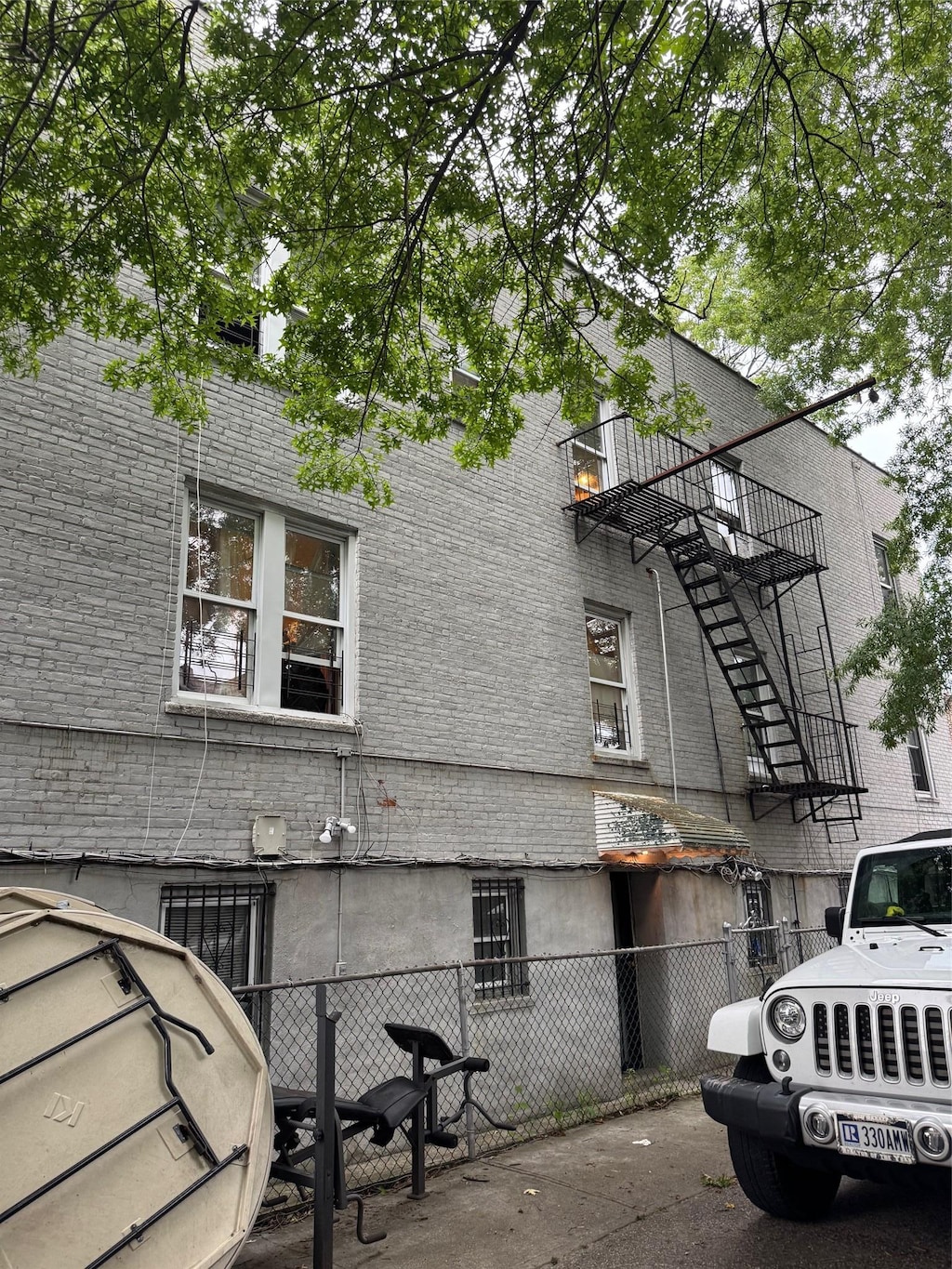3012 Bronxwood Ave, Bronx, NY 10469 - view of home's exterior with stairway and brick siding