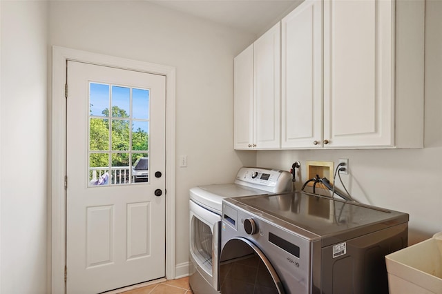 10 Inverness Ct, White Plains, NY 10605 - laundry area featuring washing machine and clothes dryer, cabinet space, and light tile patterned floors