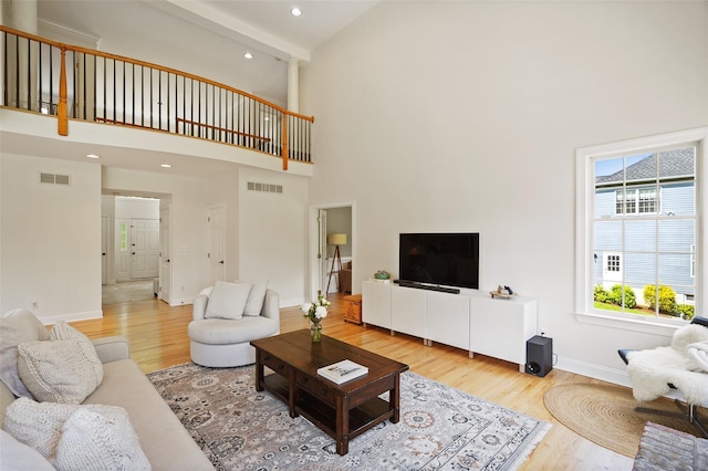 10 Inverness Ct, White Plains, NY 10605 - living room featuring high vaulted ceiling, wood finished floors, recessed lighting, and beamed ceiling