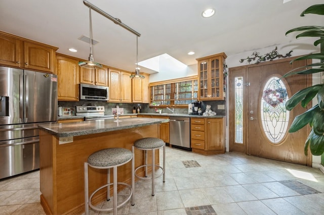 17 Piper Ln, Levittown, NY 11756 - kitchen with stainless steel appliances, a center island, recessed lighting, backsplash, and glass insert cabinets