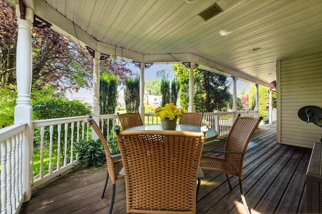 17 Piper Ln, Levittown, NY 11756 - wooden terrace featuring outdoor dining area