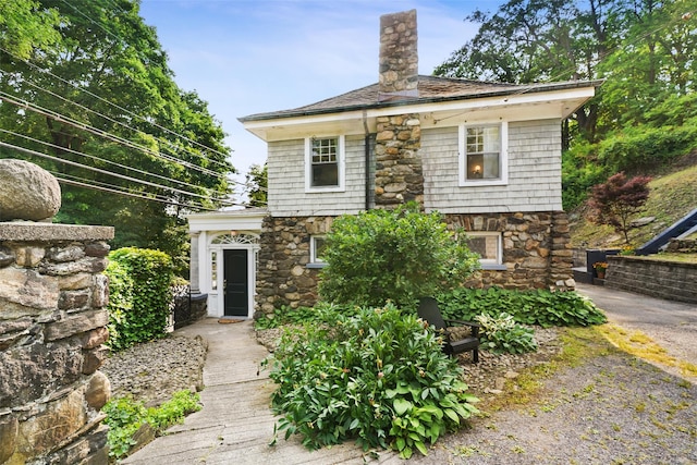 1223 Albany Post Rd, Croton-On-Hudson, NY 10520 - view of front facade with stone siding and a chimney