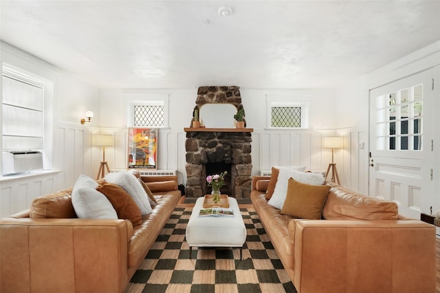 1223 Albany Post Rd, Croton-On-Hudson, NY 10520 - living room with a decorative wall, a fireplace, and a wainscoted wall