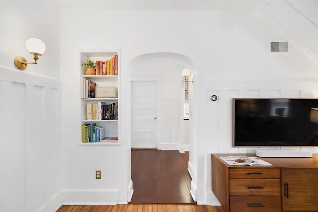 1223 Albany Post Rd, Croton-On-Hudson, NY 10520 - living area featuring arched walkways and hardwood / wood-style flooring