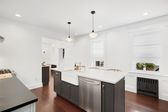 1223 Albany Post Rd, Croton-On-Hudson, NY 10520 - kitchen with stainless steel dishwasher, radiator heating unit, dark wood finished floors, decorative light fixtures, and recessed lighting
