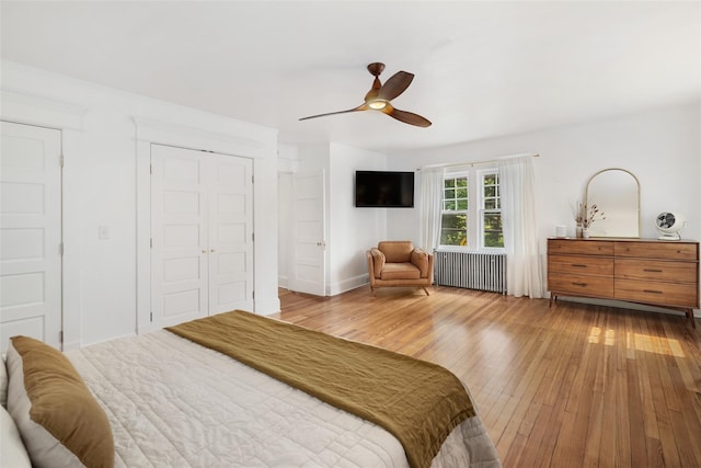 1223 Albany Post Rd, Croton-On-Hudson, NY 10520 - bedroom with radiator heating unit, hardwood / wood-style floors, ceiling fan, and a closet