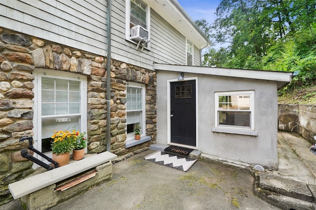 1223 Albany Post Rd, Croton-On-Hudson, NY 10520 - entrance to property featuring stone siding and cooling unit