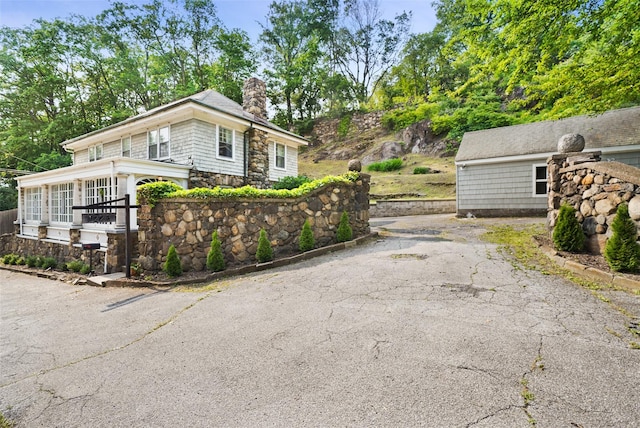 1223 Albany Post Rd, Croton-On-Hudson, NY 10520 - view of front of property featuring a chimney and stone siding