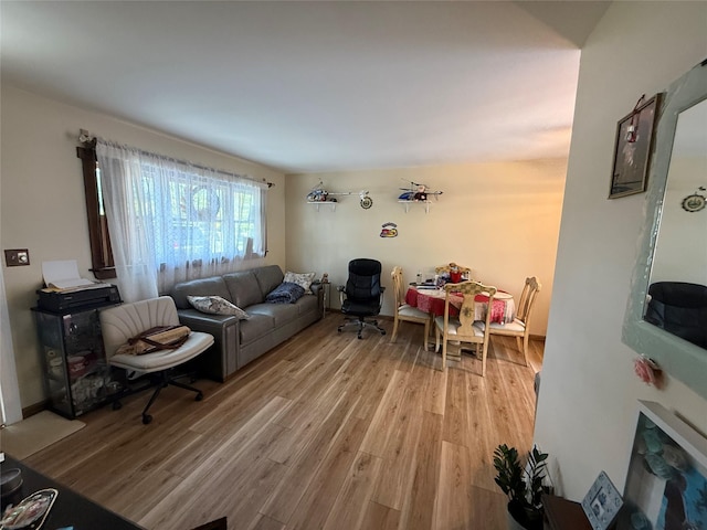 1016 Howells Rd, Bay Shore, NY 11706 - living area with light wood-style flooring
